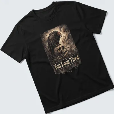 Vintage distressed design with a sarcastic vulture and the text You Look Tired — printed on a unisex t-shirt