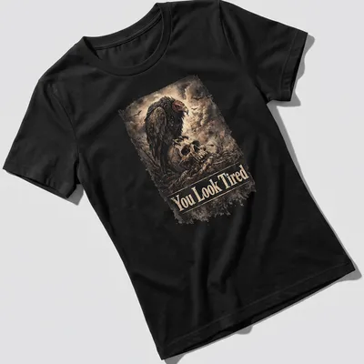 Vintage distressed design with a sarcastic vulture and the text You Look Tired — printed on a women's shirt