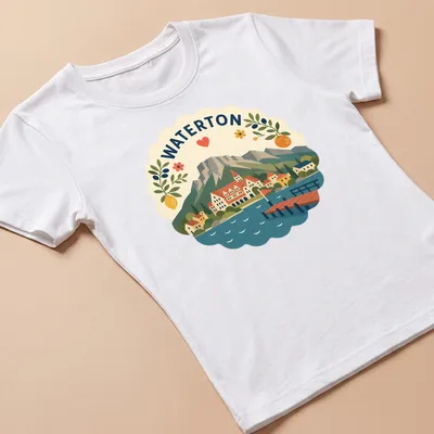 Modern folk art style Waterton landscape T-shirt with heart and flowers — printed on a women's shirt