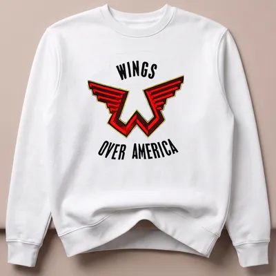 Bold graphic Wings Over America shirt featuring red, black, and yellow colors — printed on a unisex sweatshirt