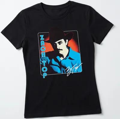 Bold retro cowboy graphic with the phrase Zach Top in blue, red, black, and white — printed on a women's shirt